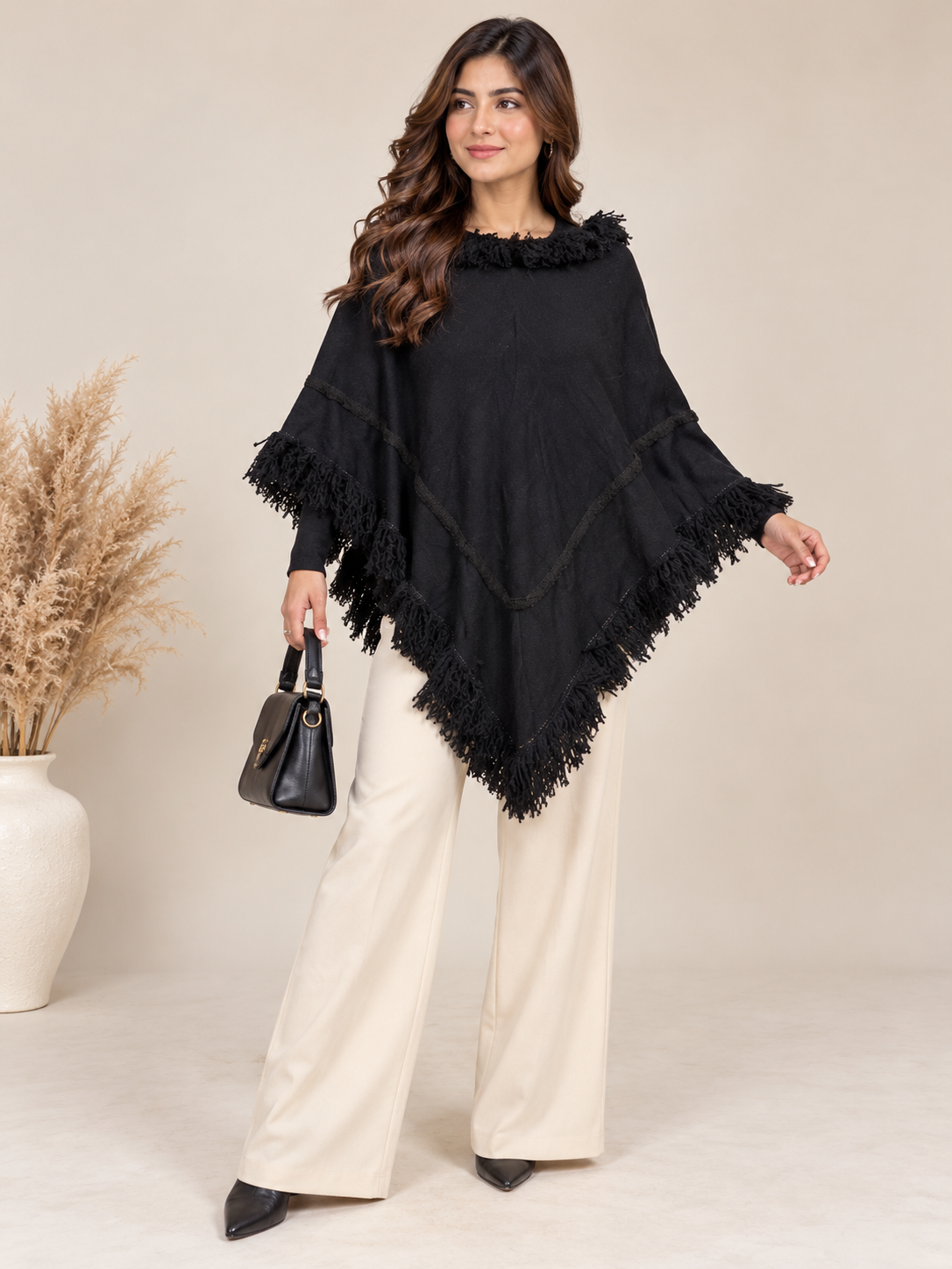 ASALAH Women's Black Fringe Poncho Cape in UK Size L. Stylish tassel trim, V-shaped detailing and relaxed fit. Perfect for chic layering.