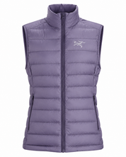   Arc'teryx Girls' Quilted Puffer Vest in lavender purple. Warm, lightweight and stylish with zipped pockets. UK size 12–14 years.