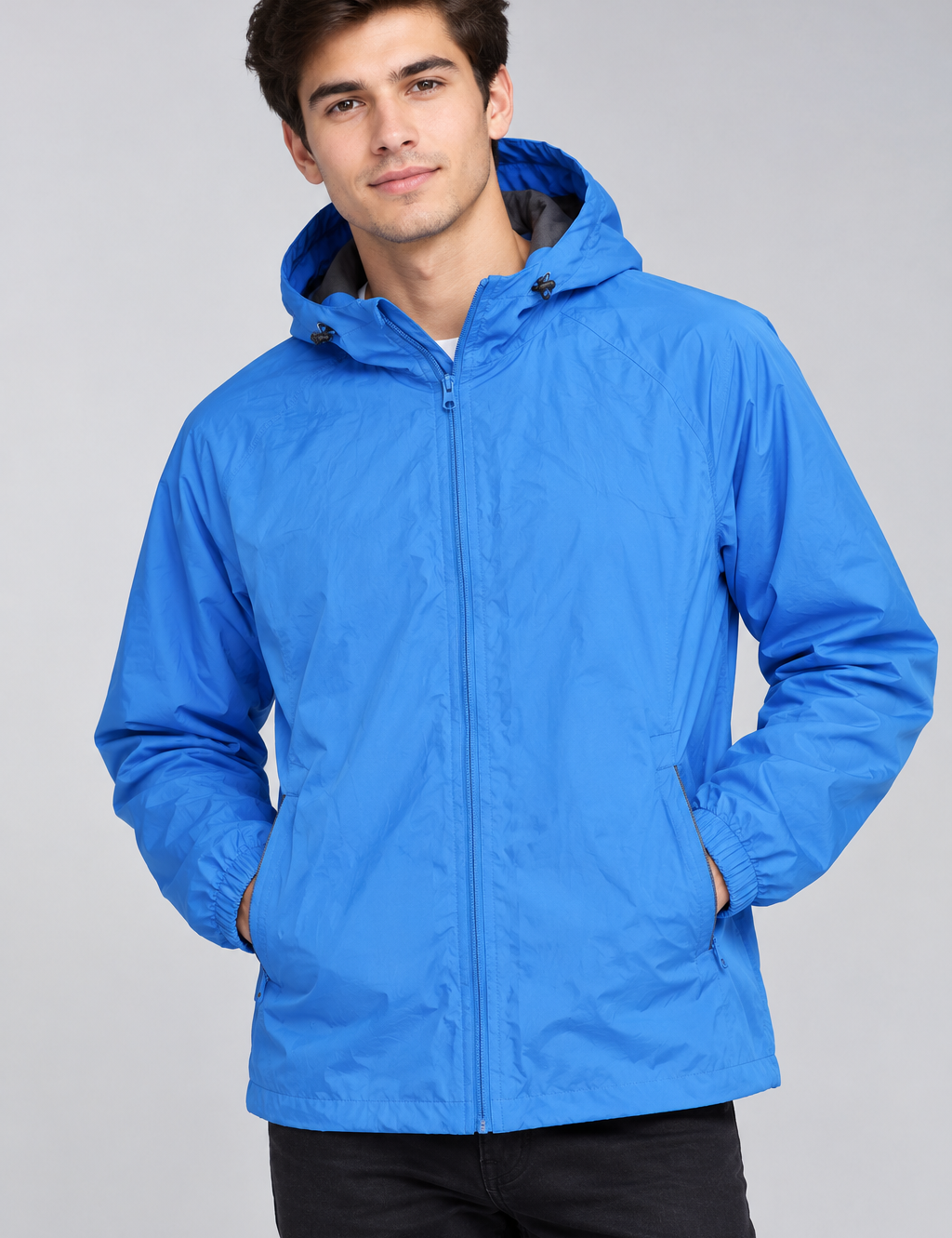  Cotton Traders men’s blue hooded windbreaker jacket in UK 2XL. Lightweight design with full zip, hood, elasticated cuffs and practical pockets.