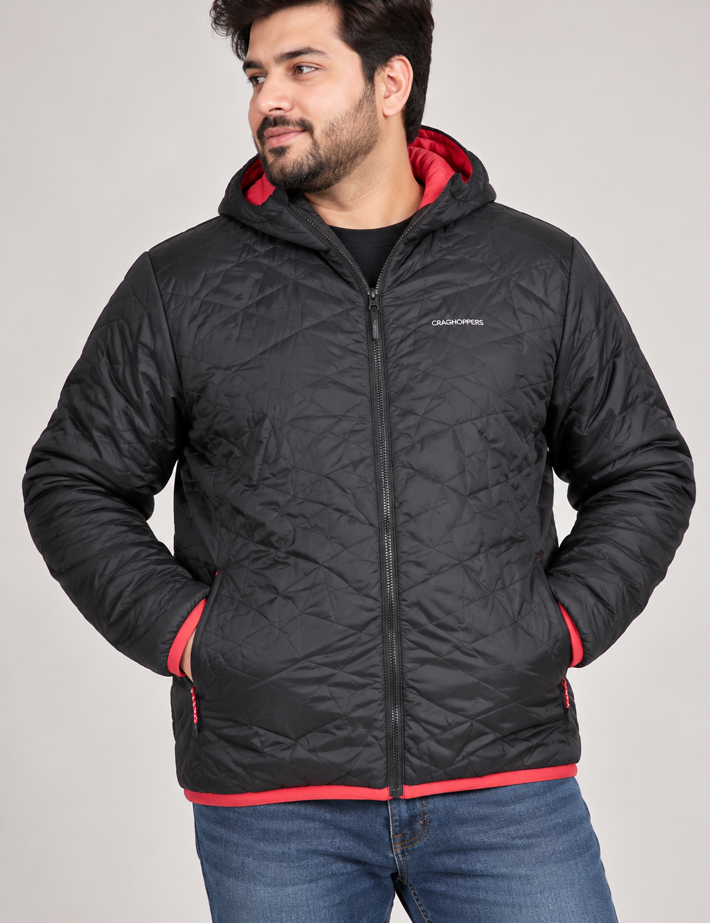 CRAGHOPPERS men’s black quilted hooded jacket in UK XXL with red contrast trim, zip pockets and lightweight padded design. Original UK customer return.