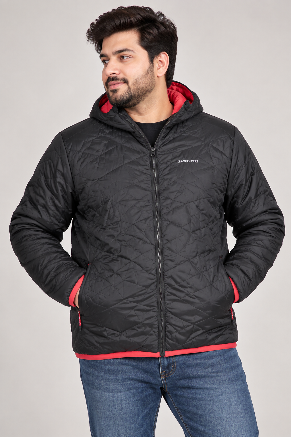 CRAGHOPPERS men’s black quilted hooded jacket in UK XXL with red contrast trim, zip pockets and lightweight padded design. Original UK customer return.
