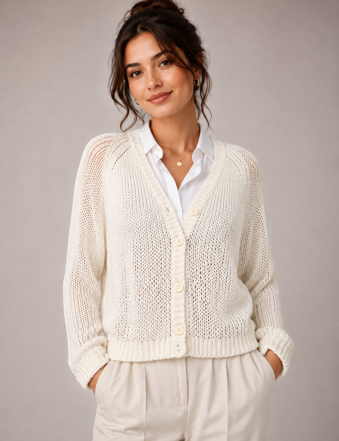 Dorothy Perkins cream ivory open-knit cardigan in UK size 18. Stylish button-front design with long sleeves, V-neck and versatile layering appeal.