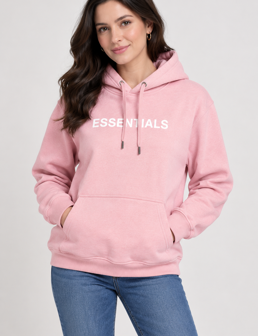   Essentials women’s pink hoodie in UK Size L. Casual pullover design with hood, kangaroo pocket, long sleeves and signature ESSENTIALS chest print.