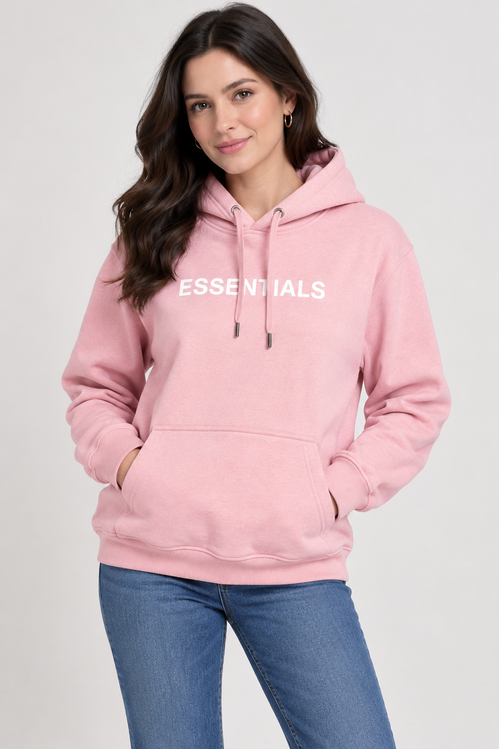   Essentials women’s pink hoodie in UK Size L. Casual pullover design with hood, kangaroo pocket, long sleeves and signature ESSENTIALS chest print.