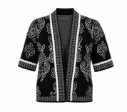  Eyida Made in Italy women’s black and white floral knit cardigan. Stylish short-sleeve open-front design with elegant patterned detailing.
