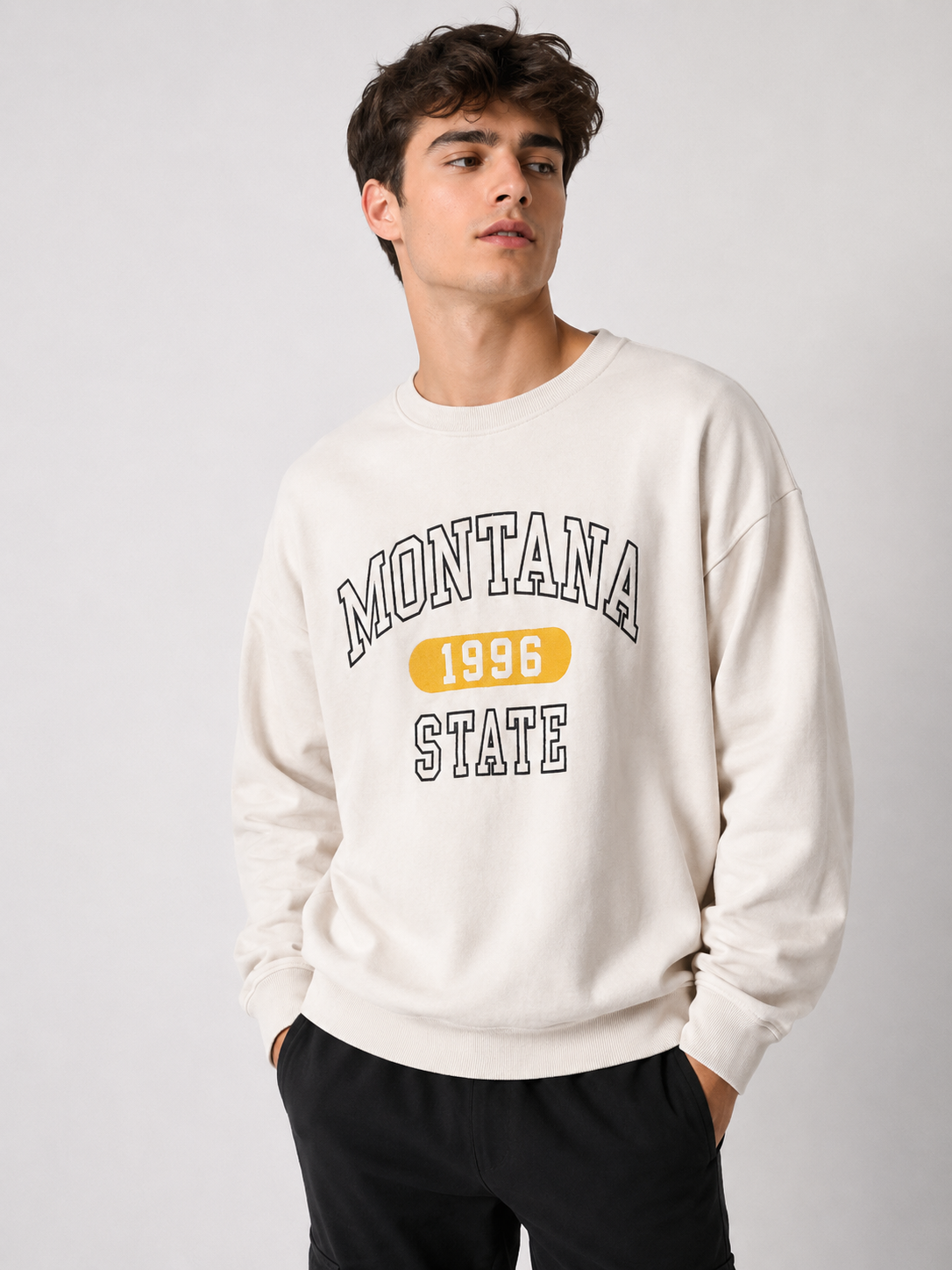   F&F Montana State 1996 cream sweatshirt in UK Size 12. Stylish varsity graphic, crew neck and long sleeves make it ideal for casual everyday wear.
