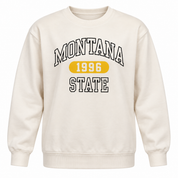  this F&F Montana State 1996 cream sweatshirt in UK size S. A comfortable women’s varsity-style crew neck jumper with a bold graphic print.
