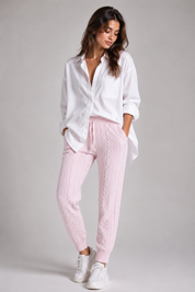 F&F Light Pink Cable Knit Jogger Trousers for women. Soft knitted fabric, cable-knit texture, elastic waist, and comfortable fit. Perfect for casual wear, lounging, and winter fashion.