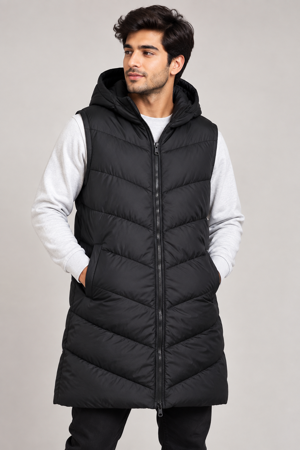 the FLUID Men’s Black Longline Hooded Puffer Gilet in UK Size L. A warm, stylish padded bodywarmer ideal for winter layering and casual wear.