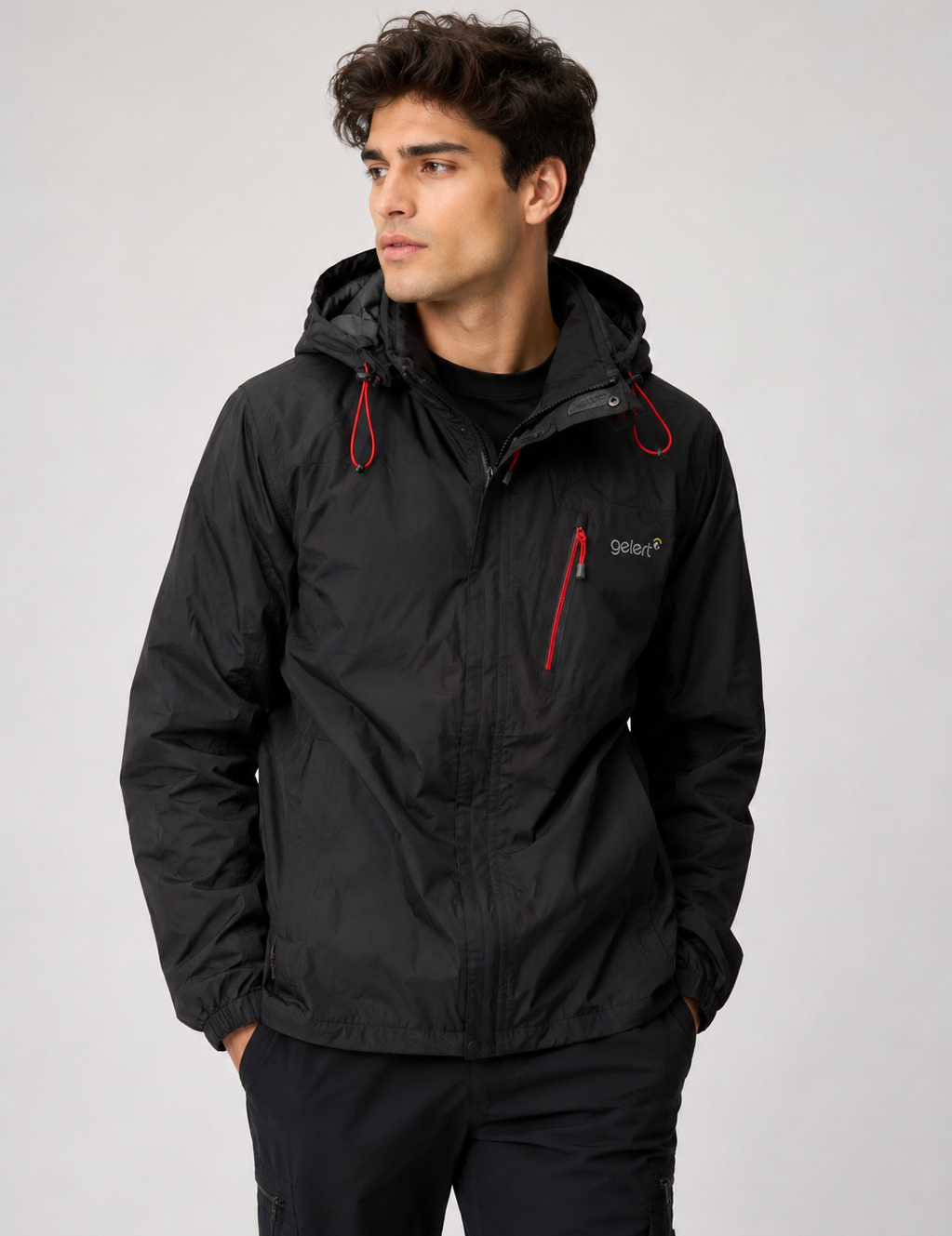 Gelert men’s black hooded outdoor jacket in UK size L. Lightweight design with red zip details, adjustable hood and practical zipped pocket.