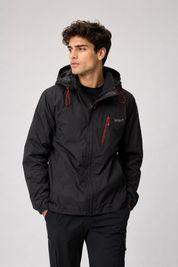 Gelert men’s black hooded outdoor jacket in UK size L. Lightweight design with red zip details, adjustable hood and practical zipped pocket.