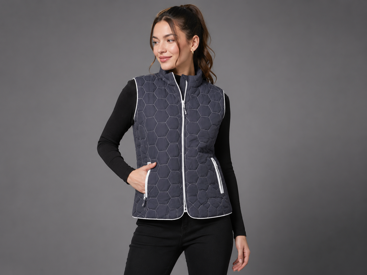  Grenouille Women's Hexagon Quilted Gilet Vest featuring lightweight padded insulation, secure zip pockets, and a stylish sleeveless design. Perfect for everyday layering.