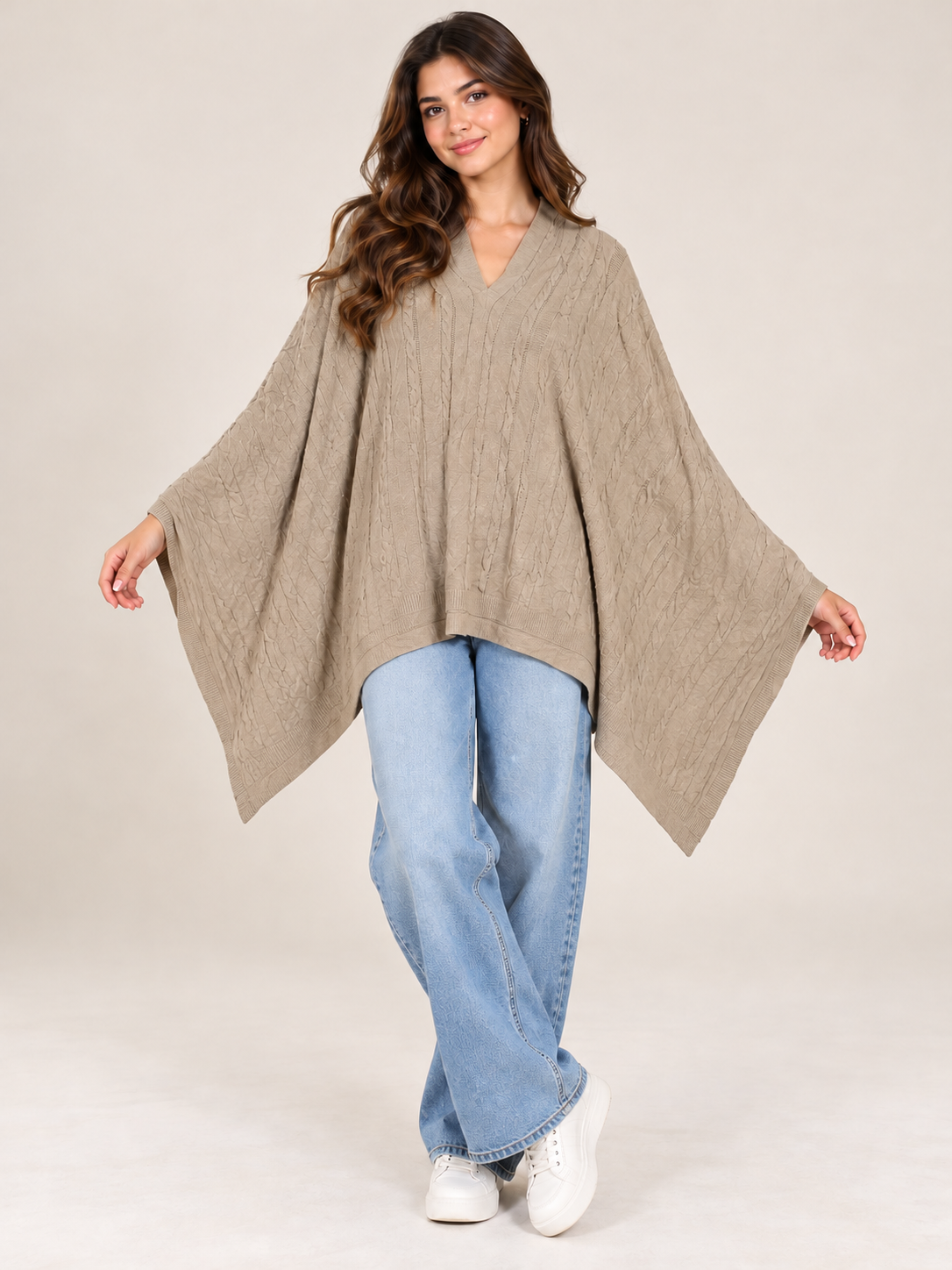 H&M Women's Beige Cable Knit V-Neck Poncho in UK Size M. Stylish oversized batwing design with flowing sides, perfect for casual winter layering.