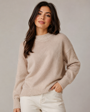 Add timeless elegance to your wardrobe with this H&M Women's Beige Shimmer Knit Mock Neck Sweater. Designed with a soft-touch knit fabric and a subtle shimmer finish, this sweater offers both comfort and sophistication. The mock neck design, relaxed fit, and ribbed cuffs and hem make it perfect for casual outings, office wear, or layering during colder seasons.