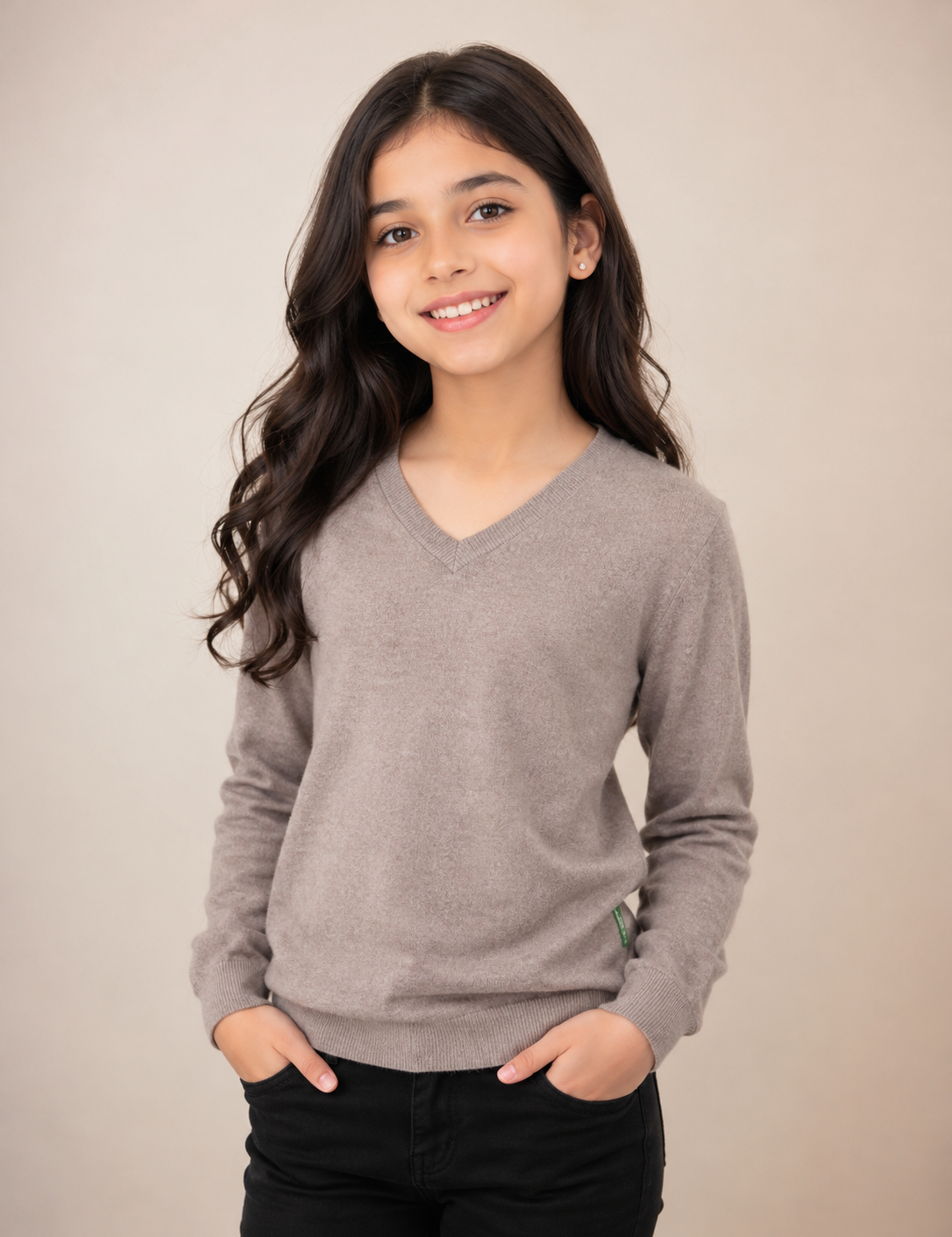  House of Edinburgh Girls’ V-Neck Knit Sweater in taupe beige, UK Size S. Stylish long-sleeve knitted jumper with ribbed details, perfect for school and everyday wear.