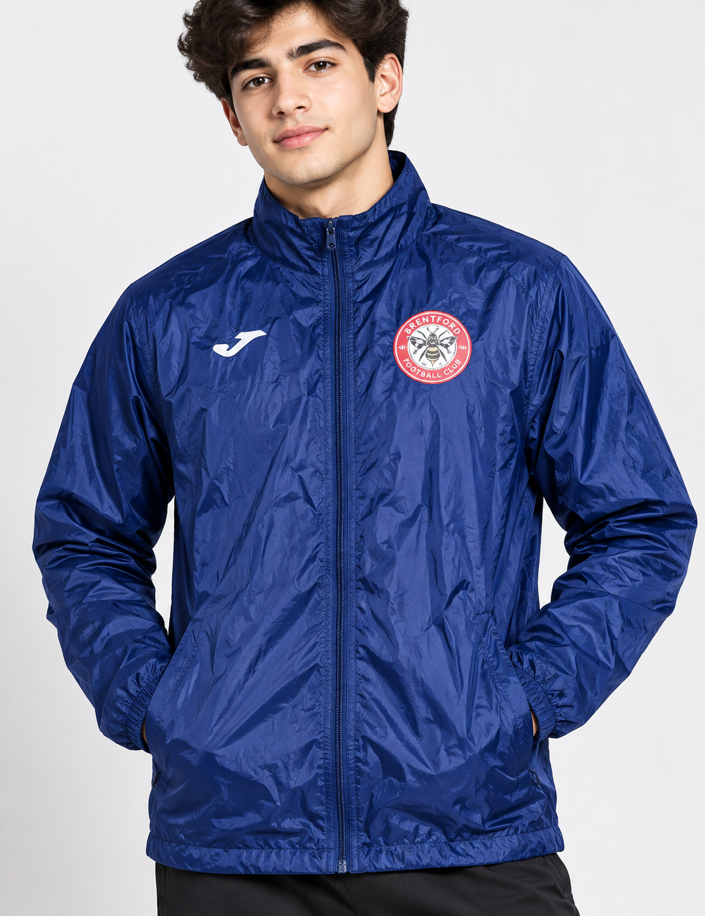 JOMA Boys Brentford Football Club navy blue windbreaker jacket in UK Size S. Lightweight zip-up football jacket with sporty club detailing.