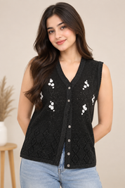  KOLETTE women’s black embellished sleeveless knit vest in UK Size S/M. Stylish V-neck, button front and textured detailing for versatile layering.