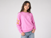  Luella girls' pink sweatshirt in UK size S, featuring a stylish star sleeve design, crew neck and ribbed trims. Perfect for everyday casual wear.