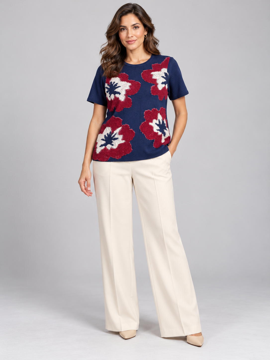   M&S women’s navy floral top in UK size 14, featuring burgundy and cream textured flowers, a round neck and short sleeves.