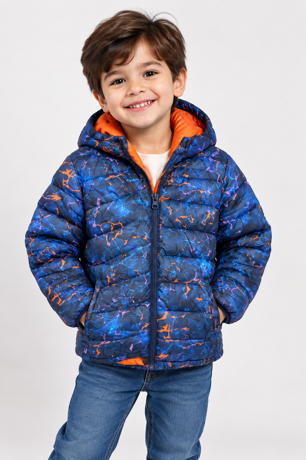  Mountain Warehouse kids blue printed puffer jacket in UK size 3-4 years. Warm hooded design with orange lining. 4-star customer return condition.
