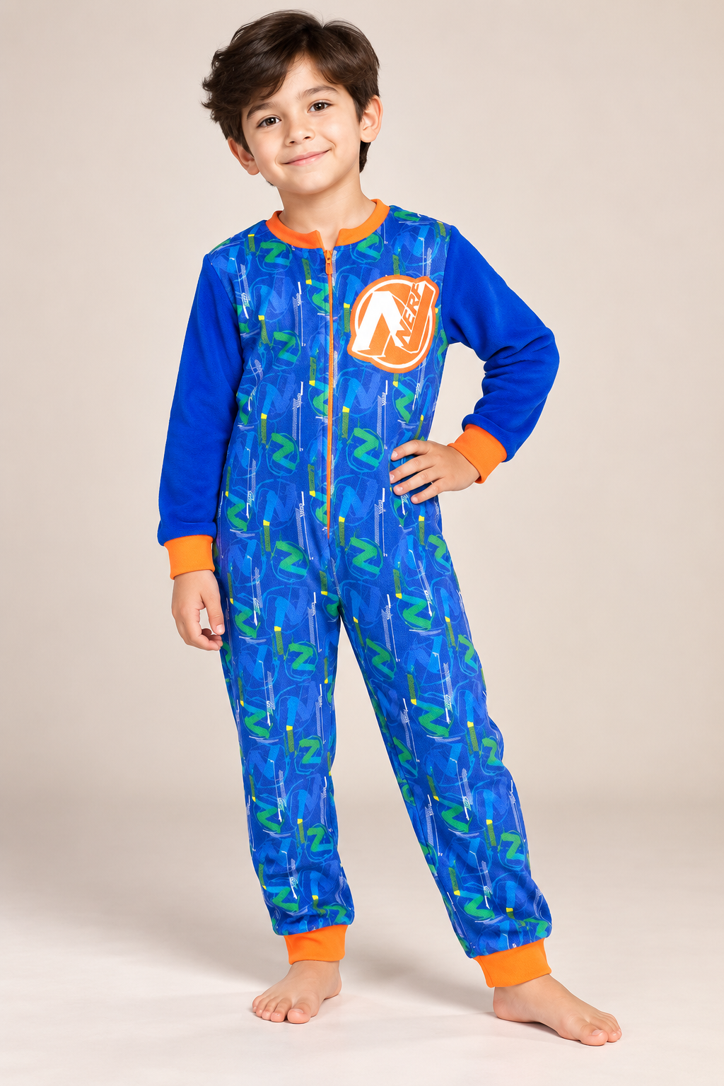 Nerf boys blue fleece onesie in UK size 7–8 years. Cosy full-zip kids sleepsuit with colourful print, long sleeves and orange cuff details.