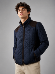   New Look men's navy quilted jacket in UK size L, featuring diamond stitching, padded warmth, zipped pockets and stylish brown detailing.