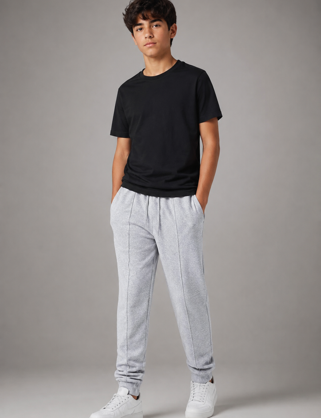  NEXT Boys Grey Jogger Trousers featuring soft fleece fabric, adjustable drawstring waist, side pockets, and ribbed cuffs. Premium UK handpicked kids' casual sweatpants for everyday comfort.
