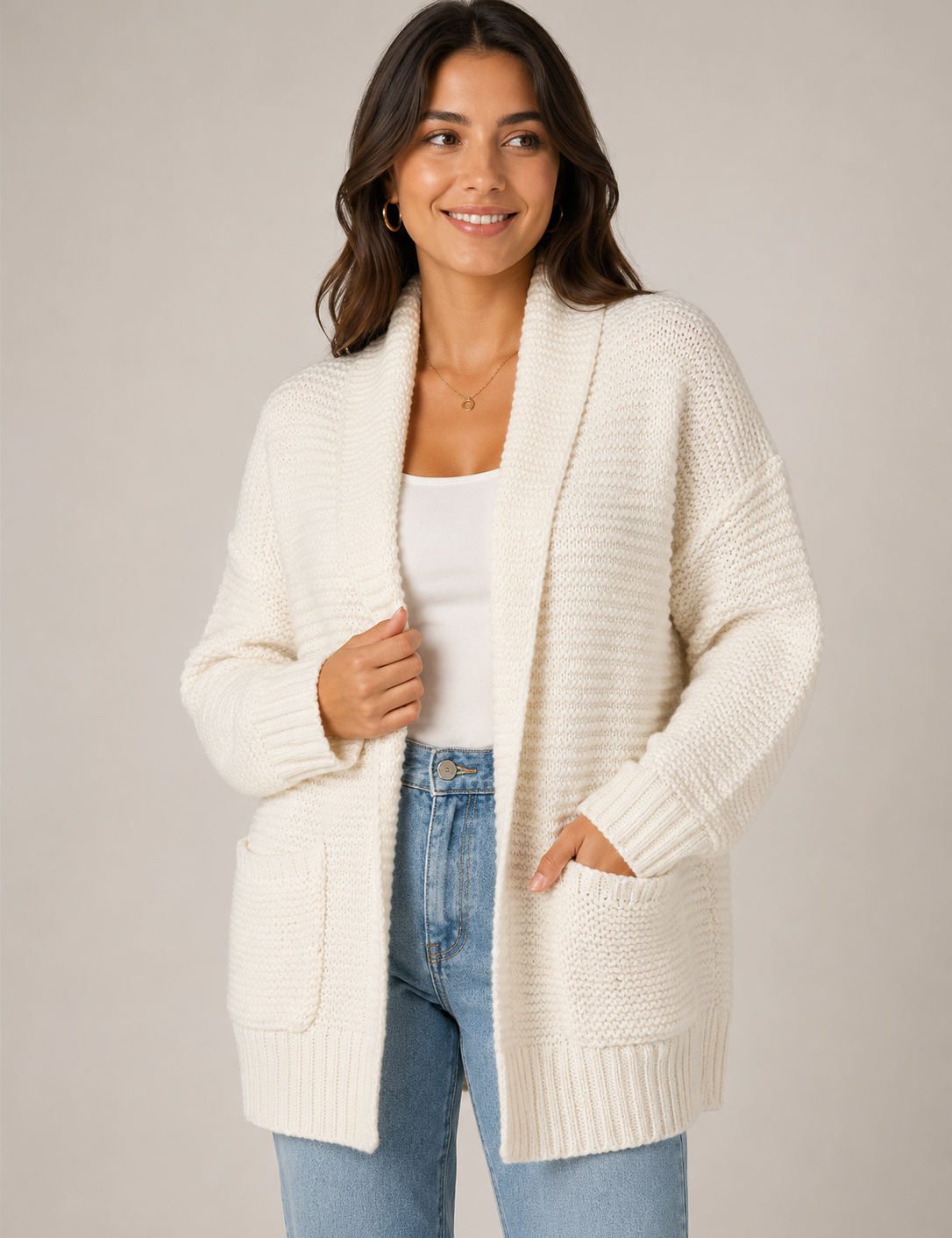 Next ivory chunky knit cardigan in UK size M, featuring a cosy textured knit, open front, shawl collar, long sleeves and practical patch pockets. Perfect for layering.