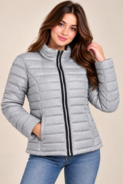 the NEXT Women’s Silver Quilted Puffer Jacket in UK Size L. Stylish lightweight padded winter jacket with high collar, full zip and pockets.