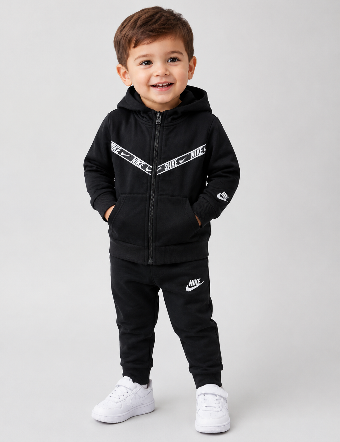  NIKE Kids Black Hooded Zip-Up Jacket in UK Size 2-3 Years. Stylish black design with hood, full zip, pockets and signature Nike detailing. Perfect for everyday wear.