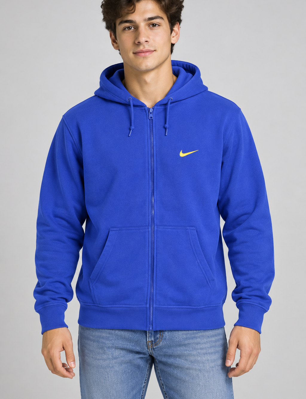  Nike royal blue full zip hoodie in UK size XL. Comfortable hood, kangaroo pockets and yellow Swoosh logo—perfect for casual everyday wear.