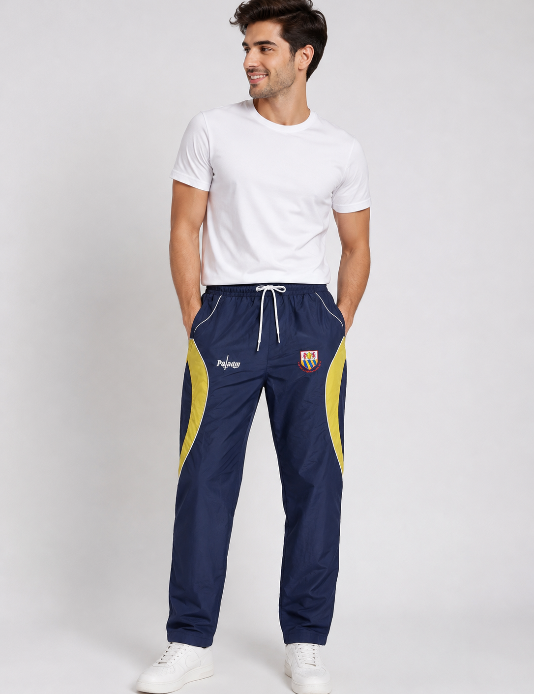  Paladin men’s navy blue and yellow track pants, UK size M, featuring an elasticated waist, drawstring and sporty side-panel design.