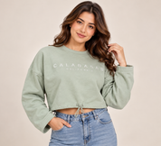 Pep&Co women’s sage green Calabasas cropped sweatshirt in UK Size L. Relaxed fit, long sleeves and adjustable drawstring hem. Original UK customer return.