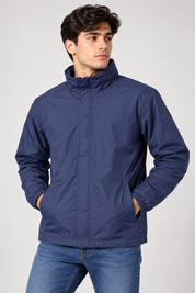 Peter Storm men’s navy blue lightweight windbreaker jacket in UK Size M. Practical outdoor styling with zip fastening, high collar and pockets.