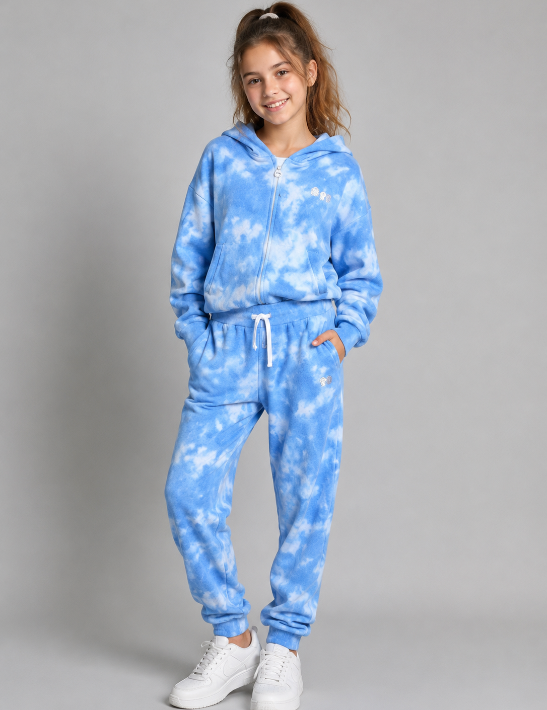  Pindyboll Girls Blue Tie-Dye Hooded Tracksuit Set featuring a soft zip-up hoodie and matching joggers. Comfortable, stylish, and perfect for everyday casual wear.