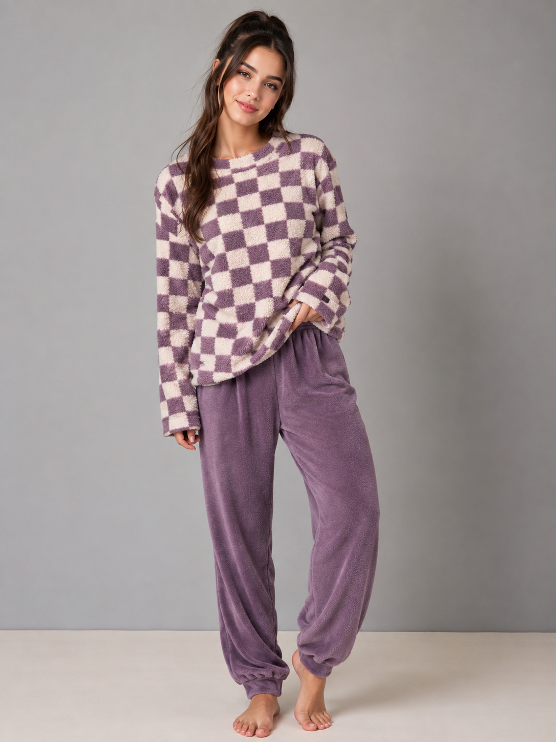 Primark purple and cream checkered fleece loungewear set, featuring a cozy plush top and matching purple joggers. Perfect for relaxed everyday and winter wear.