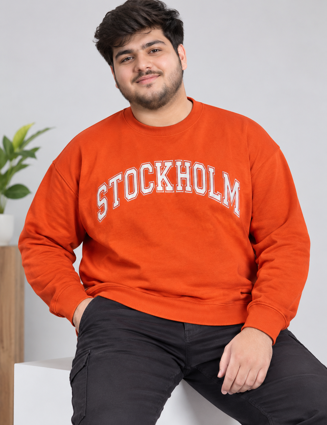  the Primark Stockholm Oversized Orange Sweatshirt in UK Size 2XL. Comfortable crew neck graphic jumper for men's casual streetwear, everyday fashion, and winter layering.