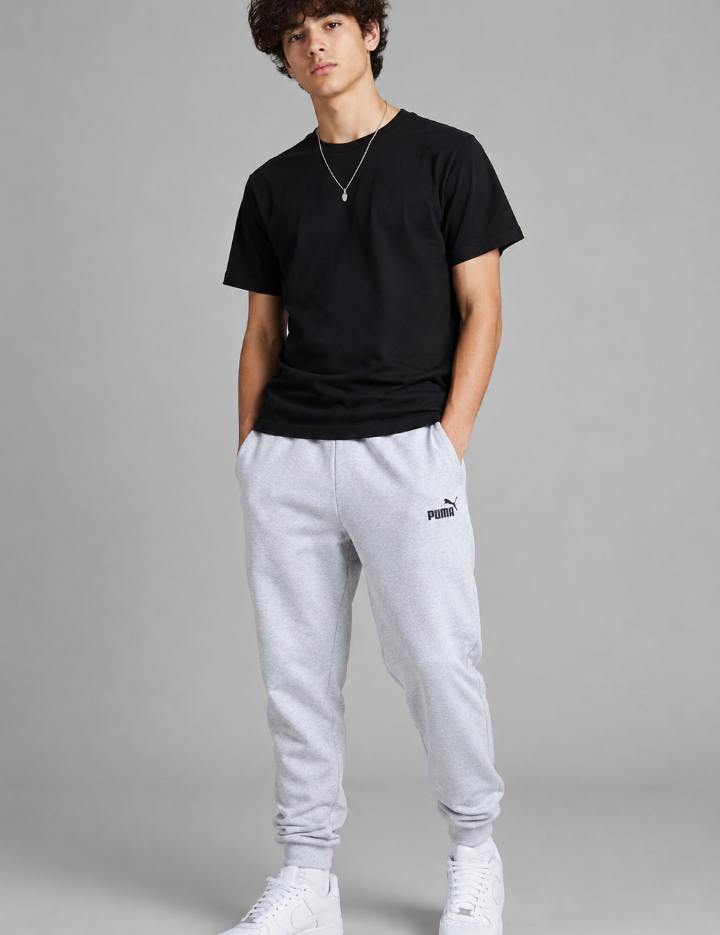  PUMA Men's Light Grey Fleece Joggers featuring a soft cotton-blend fabric, elastic waistband, ribbed cuffs, and iconic logo. Comfortable sweatpants perfect for casual wear, workouts, and everyday style.