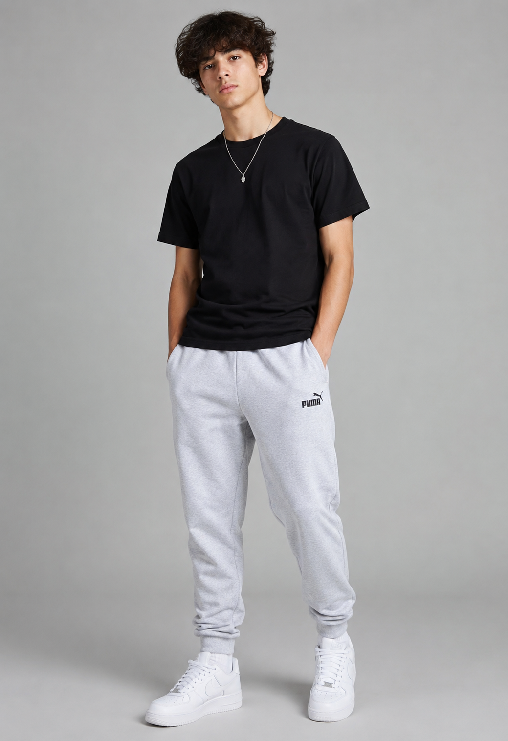  PUMA Men's Light Grey Fleece Joggers featuring a soft cotton-blend fabric, elastic waistband, ribbed cuffs, and iconic logo. Comfortable sweatpants perfect for casual wear, workouts, and everyday style.