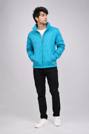 REGATTA men’s turquoise lightweight windbreaker jacket, UK size 16, featuring full zip fastening, zip pockets and a practical sporty design.