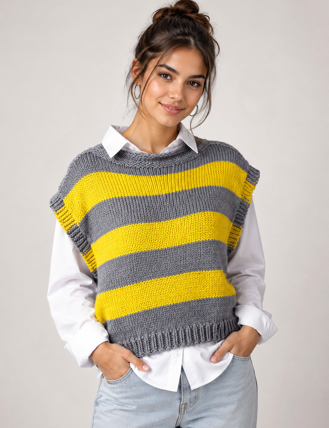  Reserved Label women’s grey and yellow striped knitted sweater vest in UK Size S. Stylish sleeveless design, textured knit and perfect for layering.
