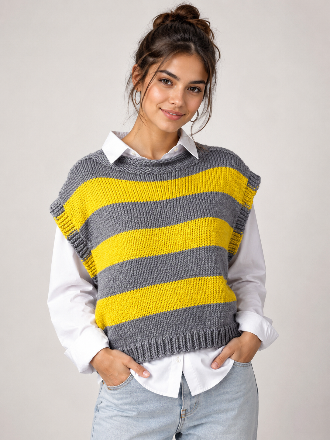  Reserved Label women’s grey and yellow striped knitted sweater vest in UK Size S. Stylish sleeveless design, textured knit and perfect for layering.
