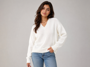   ReServed LABELS ivory white V-neck knitted jumper for women in UK XL. Stylish long-sleeve design with ribbed trims, perfect for casual and smart-casual outfits.