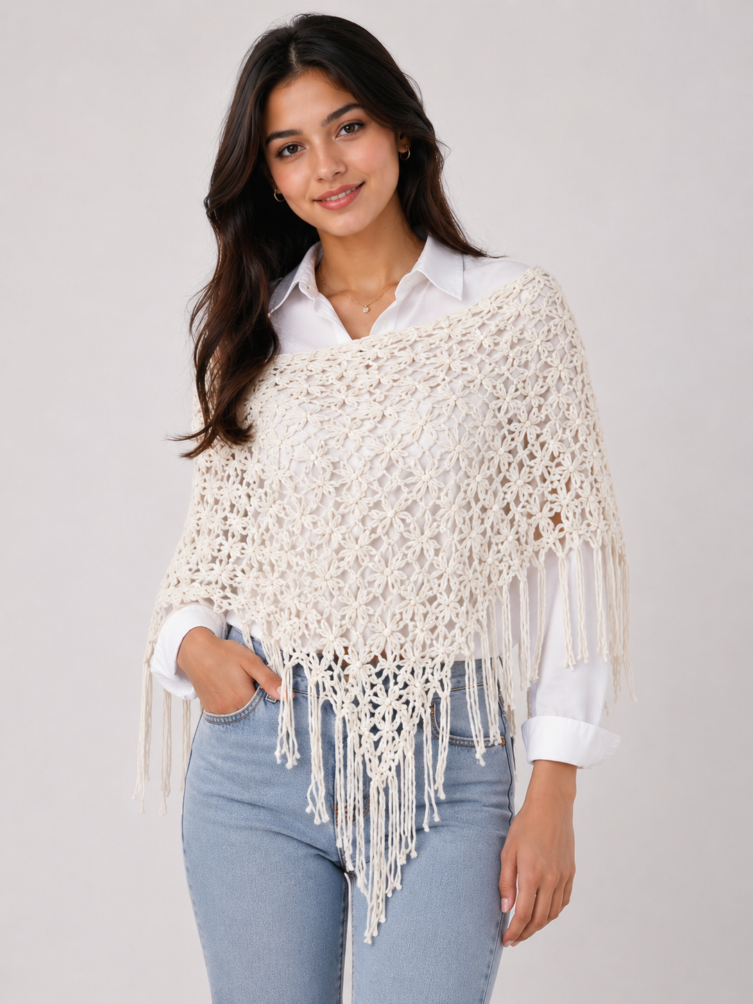  ReServed LABELS women’s cream crochet poncho, UK size L, featuring an elegant open-knit floral pattern and long fringe detailing.