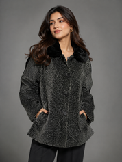  women’s black and white tweed coat with soft black collar, button fastening and stylish flared fit. UK Size L. Ideal for smart-casual outfits.