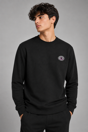 RTX men’s black crew neck sweatshirt in UK Size S. Long sleeve casual pullover with ribbed cuffs and stylish chest emblem.