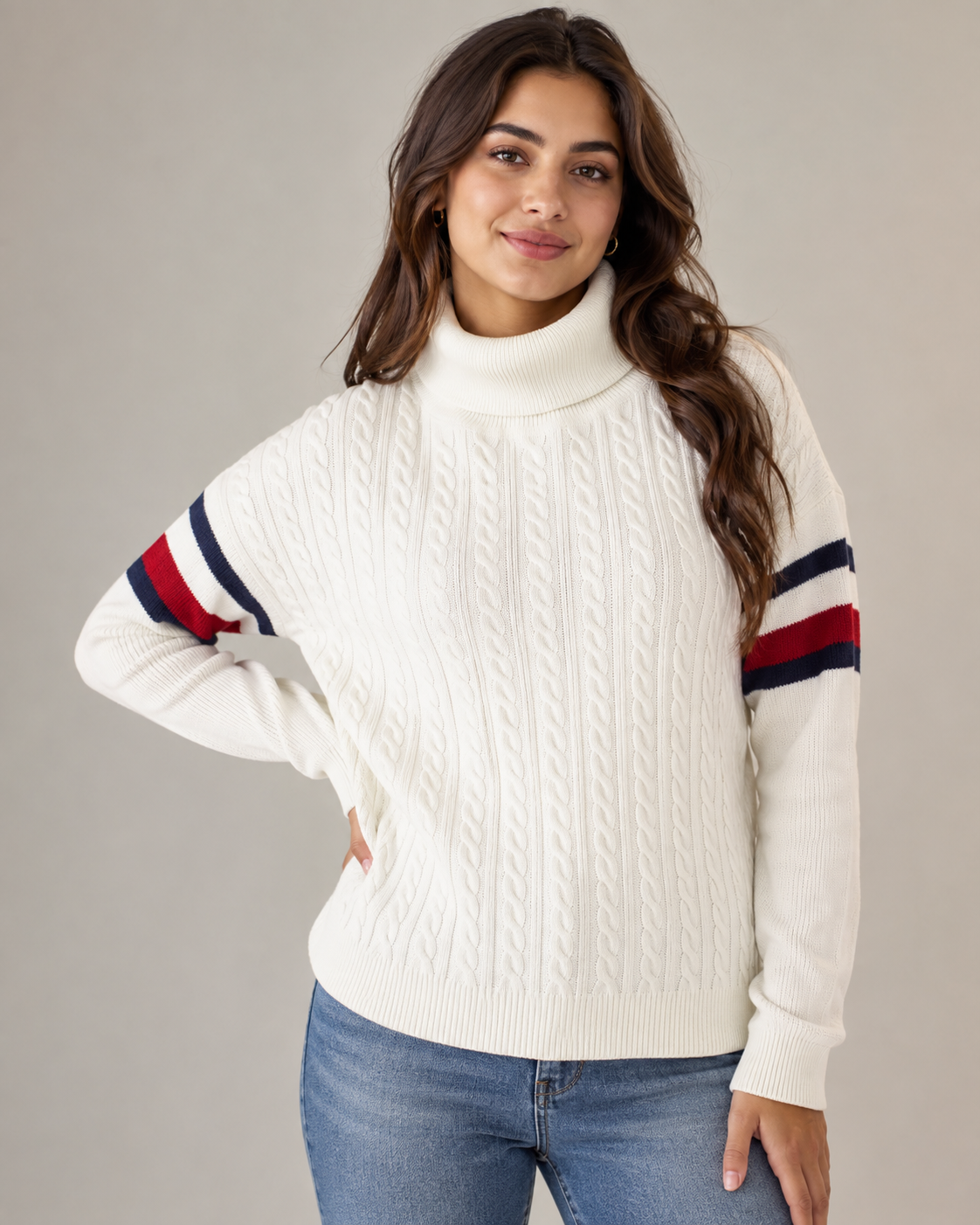  Tommy Hilfiger women’s cream cable knit turtleneck jumper in UK size M, featuring navy and red sleeve stripes. Stylish and cosy for everyday wear.